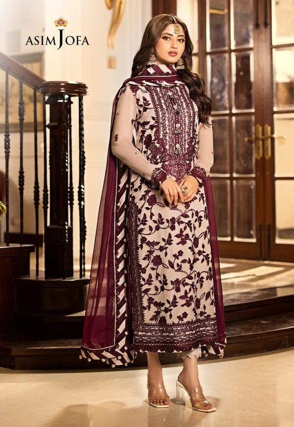 Pakistani formal wear Asim Jofa embroidered net suit with tassel details and silk trouser