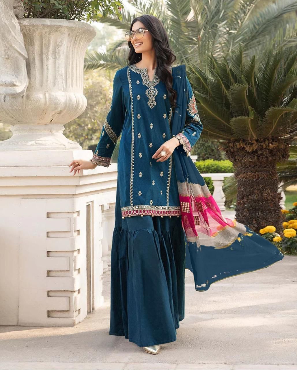 Luxury Pakistani formal wear by Maira B featuring embroidered net shirt with elegant neckline and daman borde