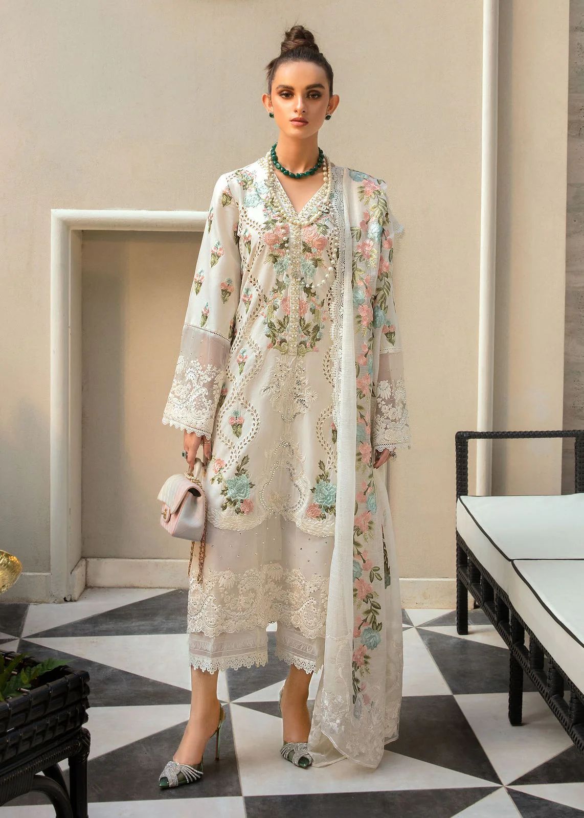Pakistani embroidered net dress with organza dupatta and tassel details